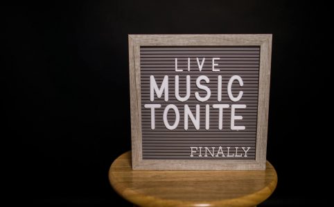 gray text board on wooden chair