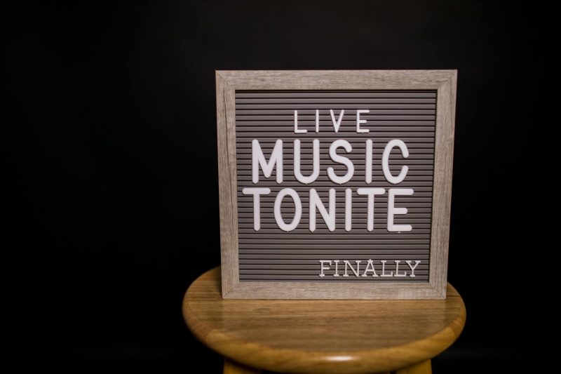 gray text board on wooden chair