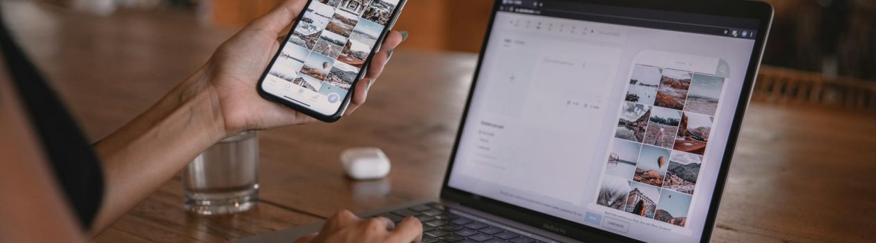 woman using smartphone and laptop