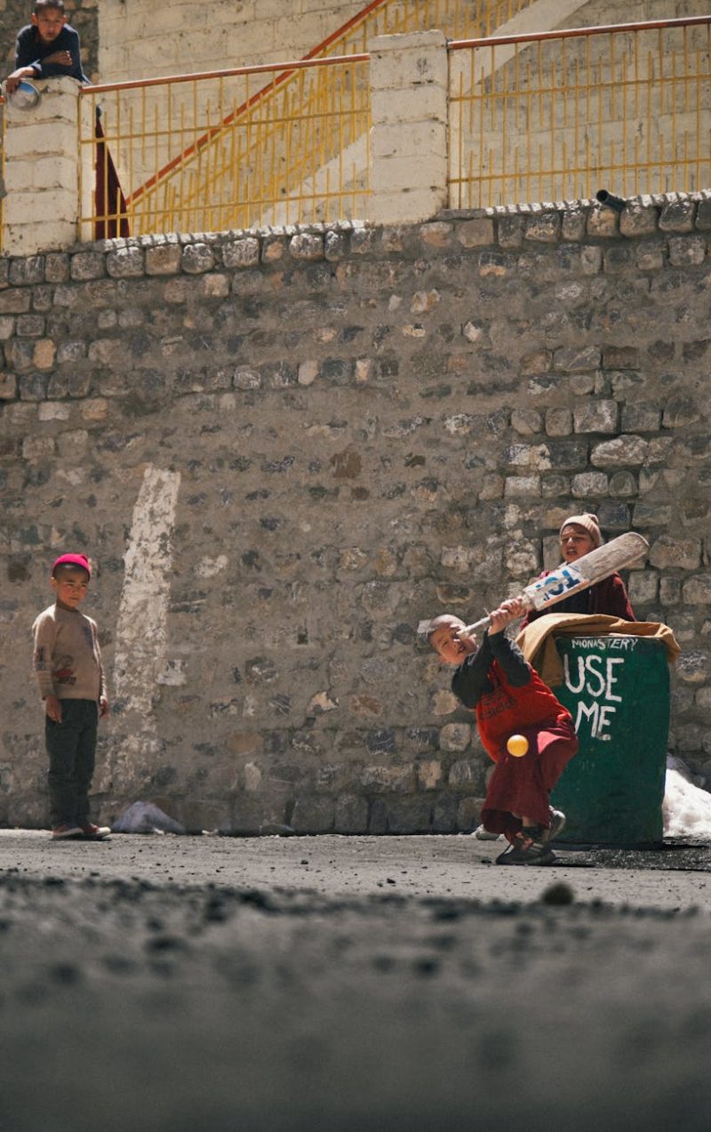 children playing cricket in key village