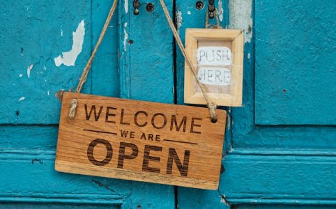 photo of wooden signage on doorknob